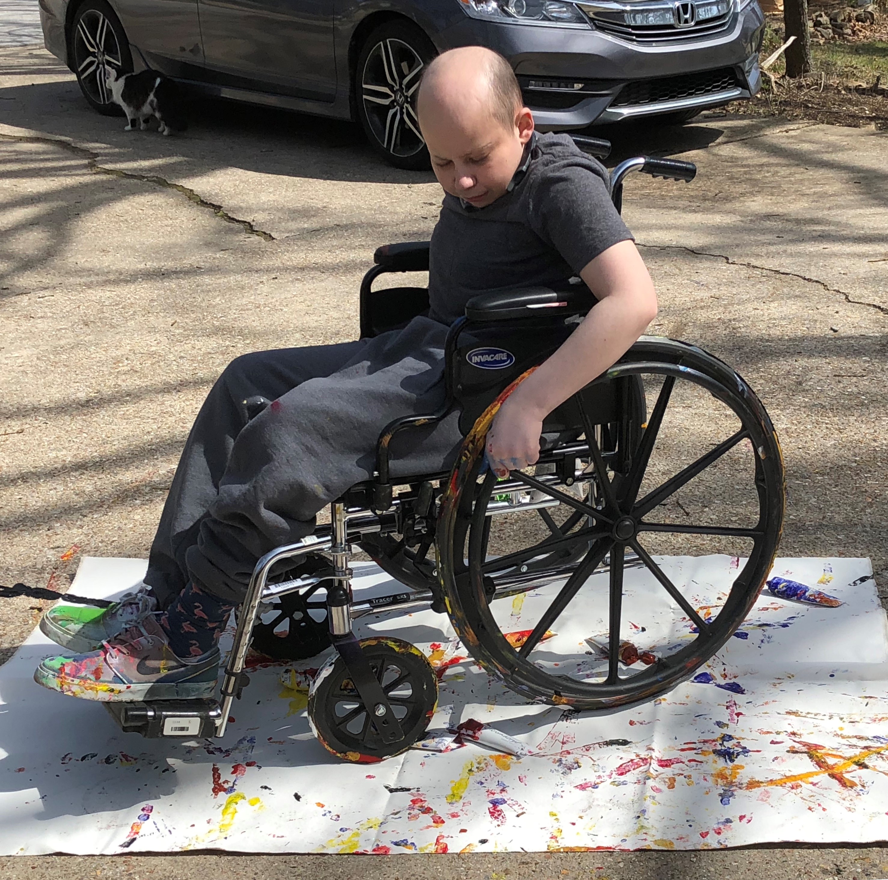 Dylan, a Phelps Health Homecare patient, painting with his wheelchair 