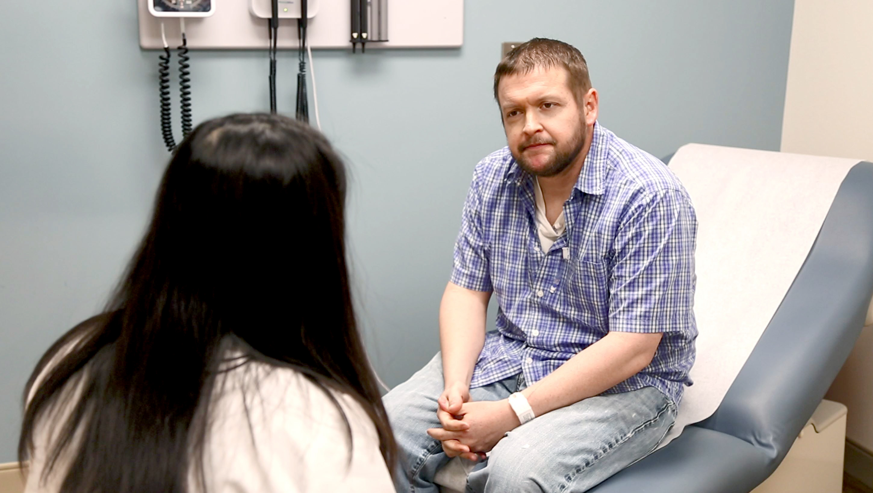 Oncologist talking with patient