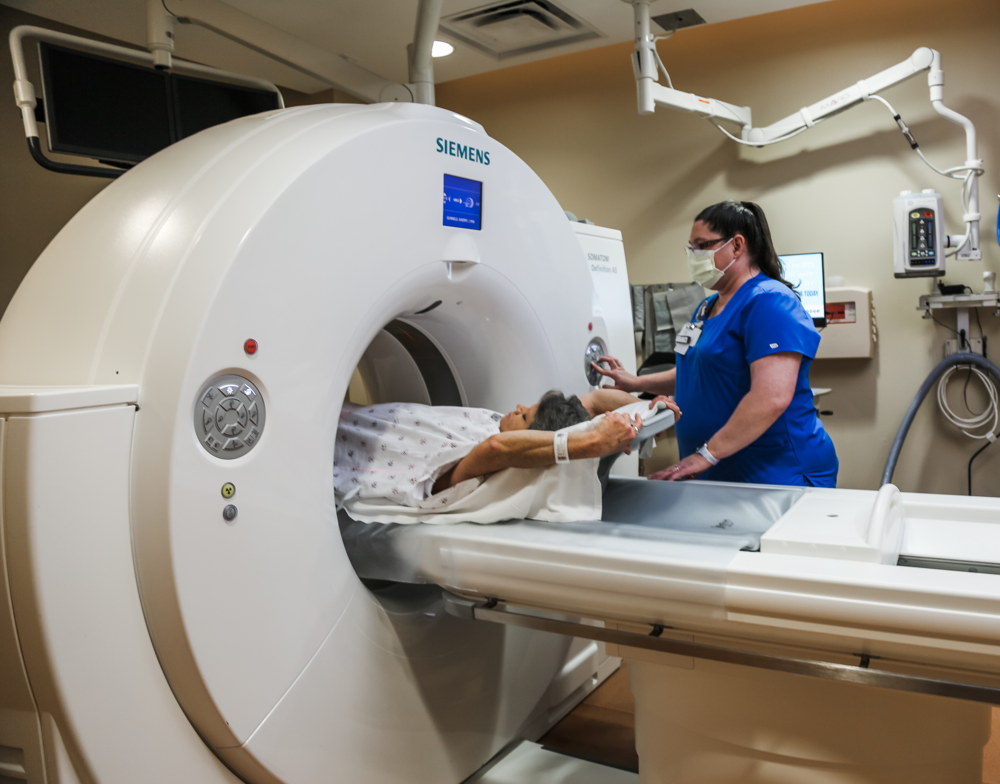 A patient has a lung cancer screening using a low-dose computed tomography (LDCT) scan with a CT technologist at Phelps Health
