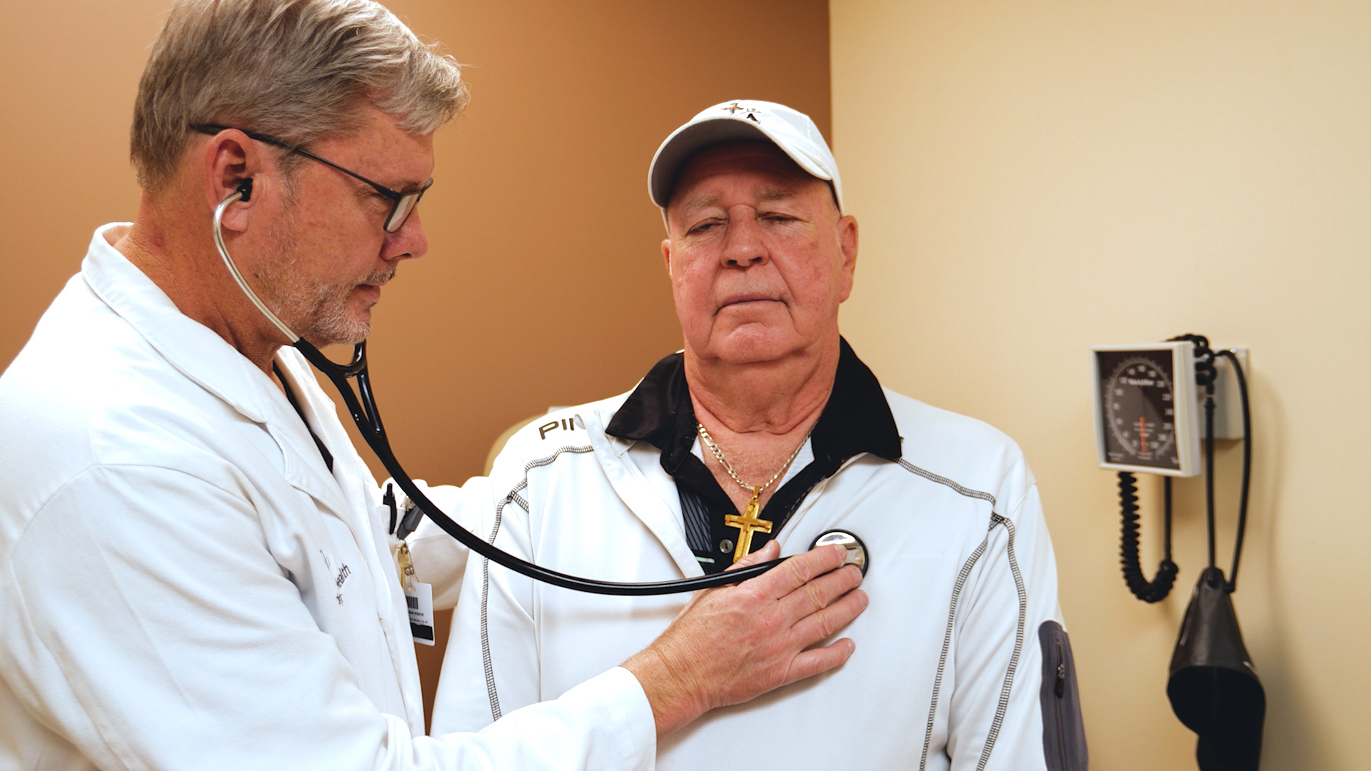Phelps Health Cardiologist Tim Martin, MD, checks patient Chet Saladin's heart.