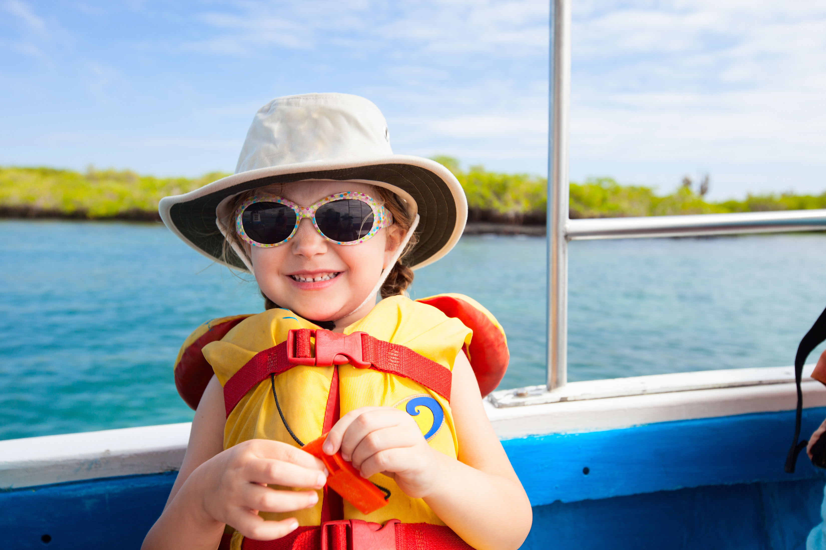 Young girl in lifejacket on boat