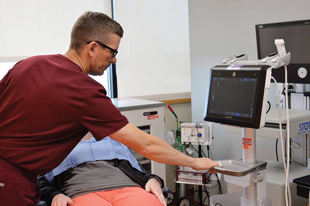 Dr. Brian Kriete performing an ultrasound Dr. Brian Kriete performing an ultrasound