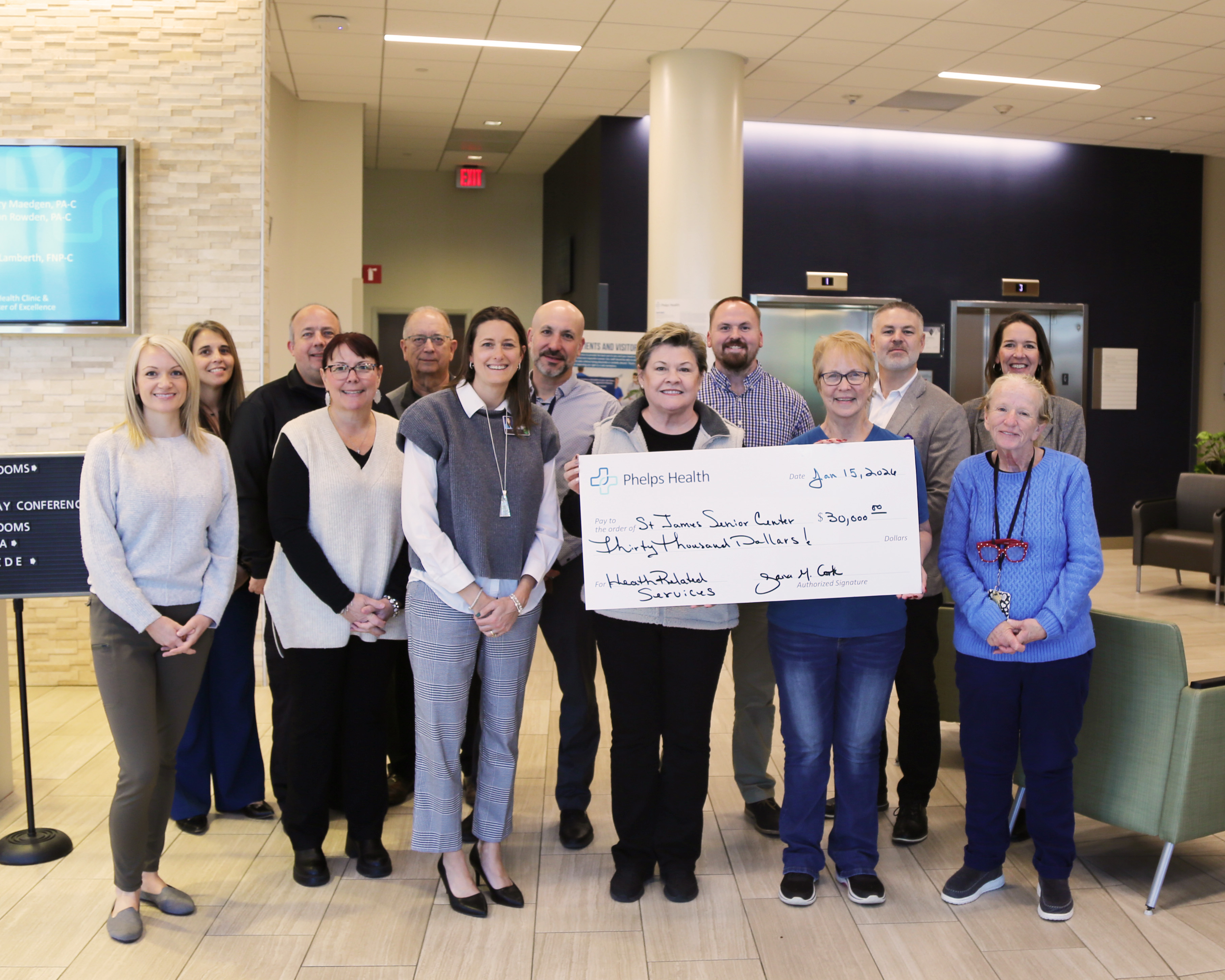 Phelps Health presents a check to the St. James Senior Center