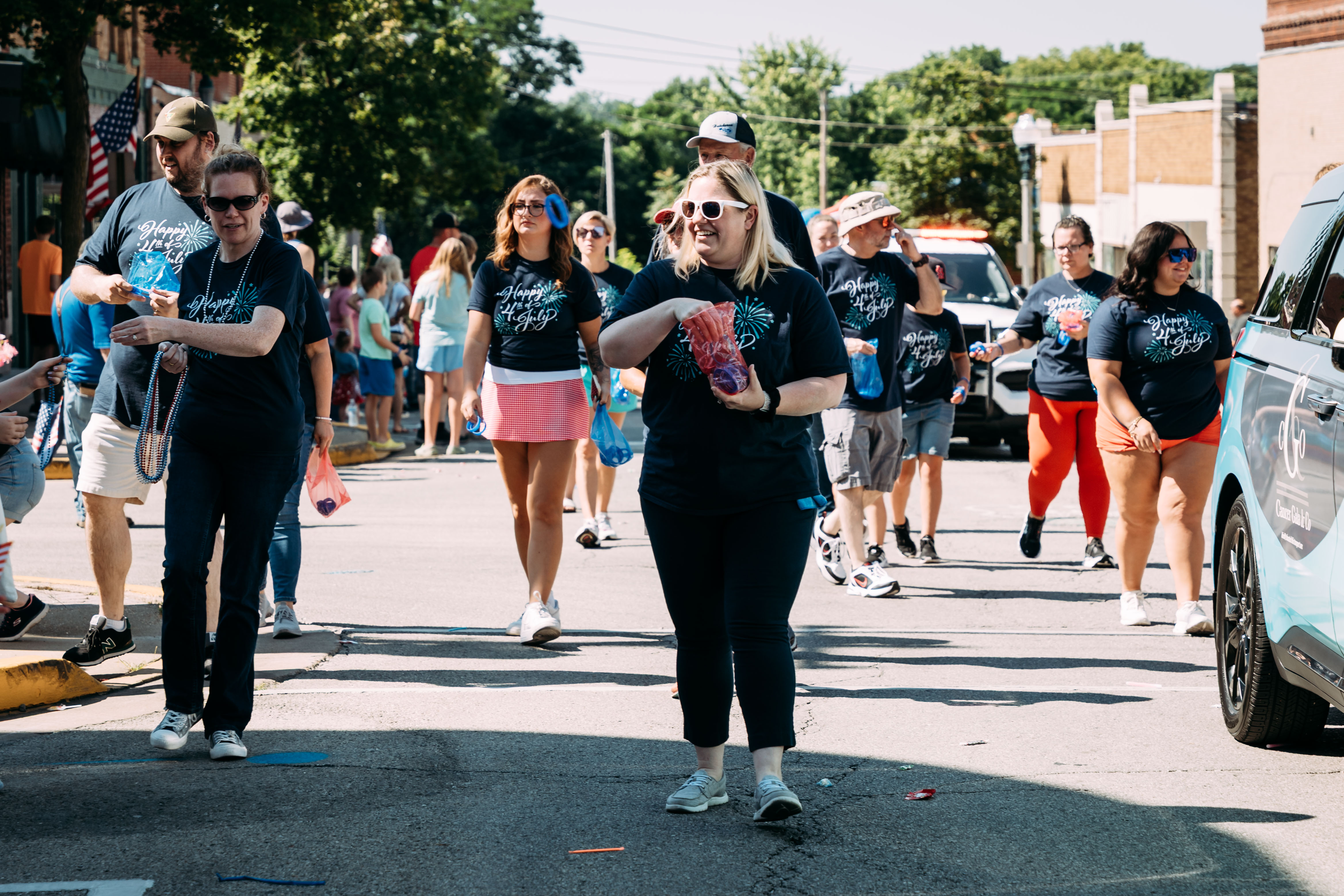 Phelps Health employees pass out bracelets at a Rolla 4th of July parade