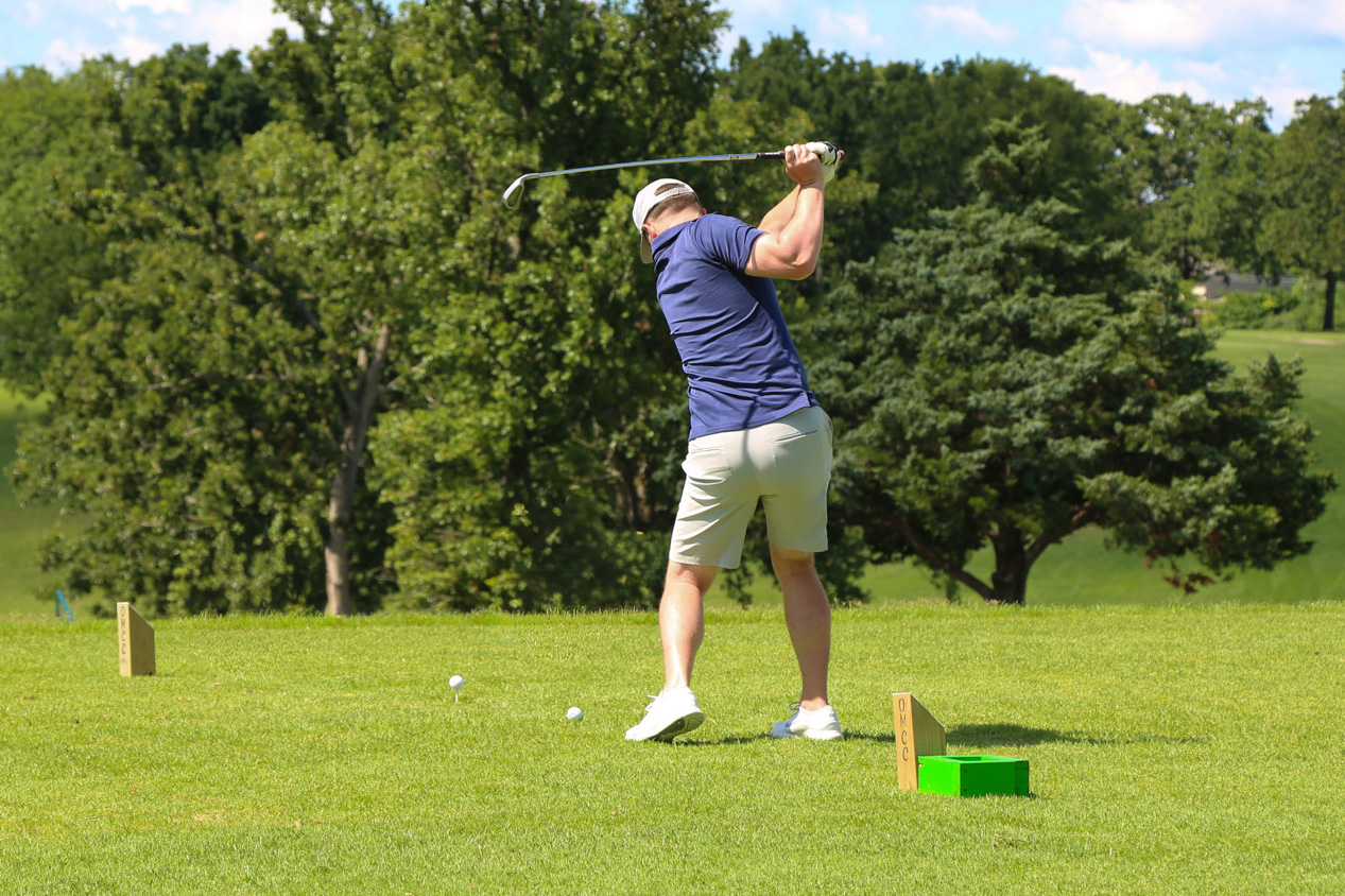 A golfer swings at the Phelps Health Foundation Charity Golf Tournament