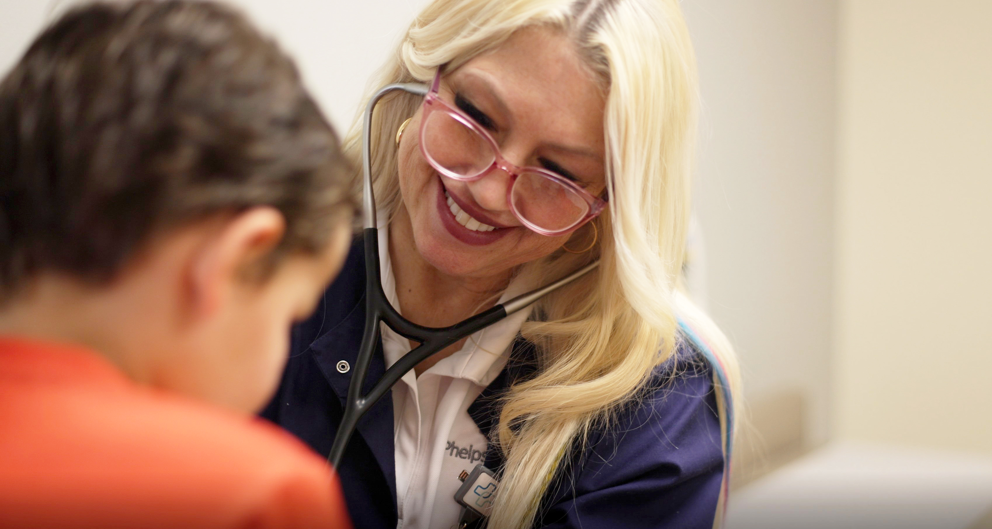Angie Watkins examines a pedicatric patient