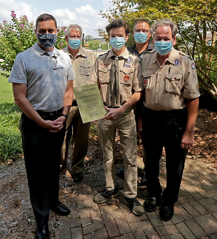Scout leaders and Phelps Health staff with Scout recognizing Eagle scout project