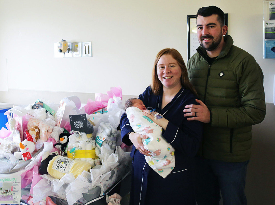 New parents Jordan and Jessica Sutton were given a play pen full of baby gifts.