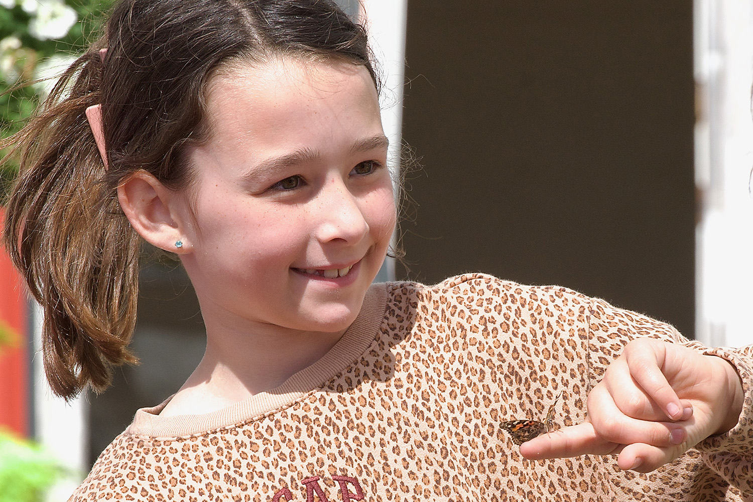Girl with monarch butterfly