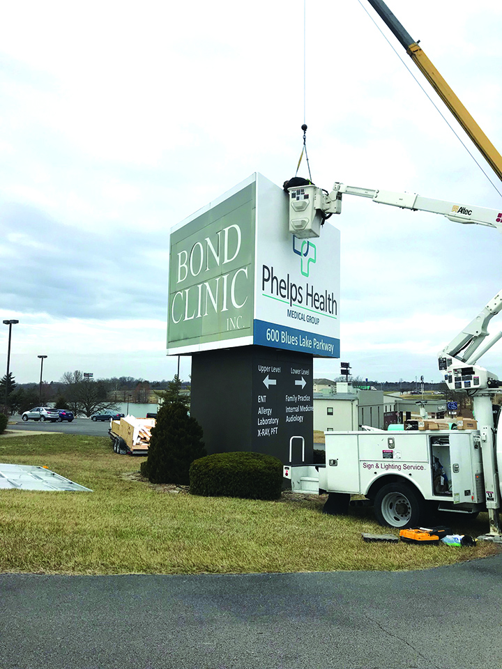 PCRMC changing out sign to Phelps Health
