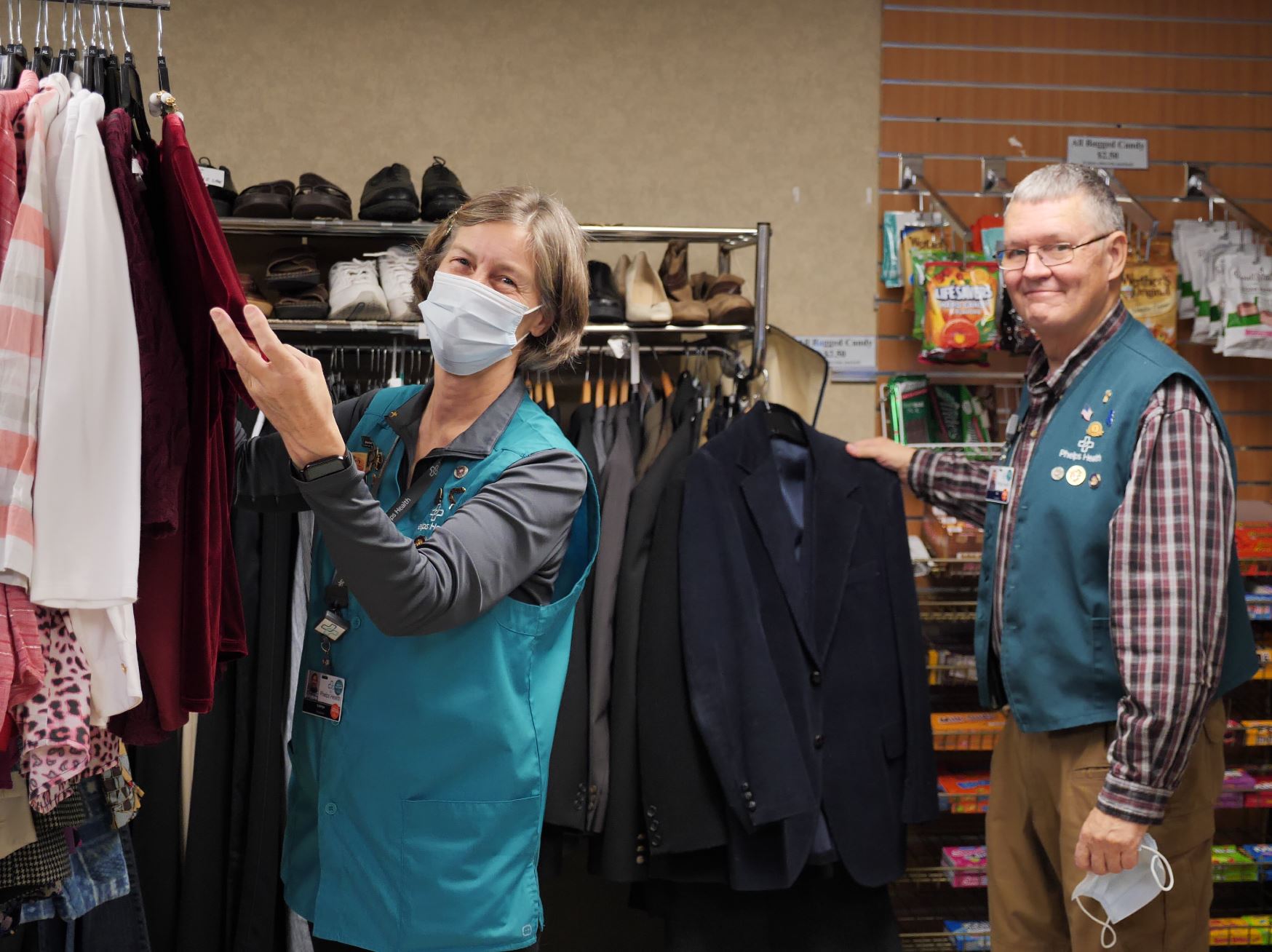 Auxiliaary volunteers Kathy Ohmann and Jim Pettit at Repeat Boutique