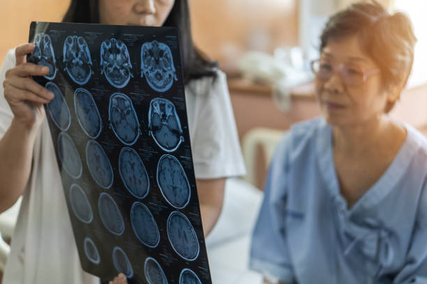 patient and doctor looking at brain scan