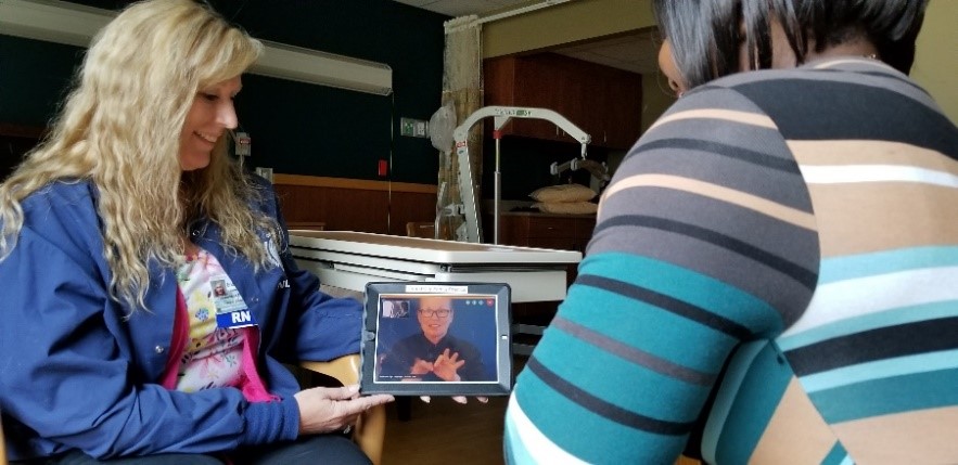 Man and woman looking at tablet