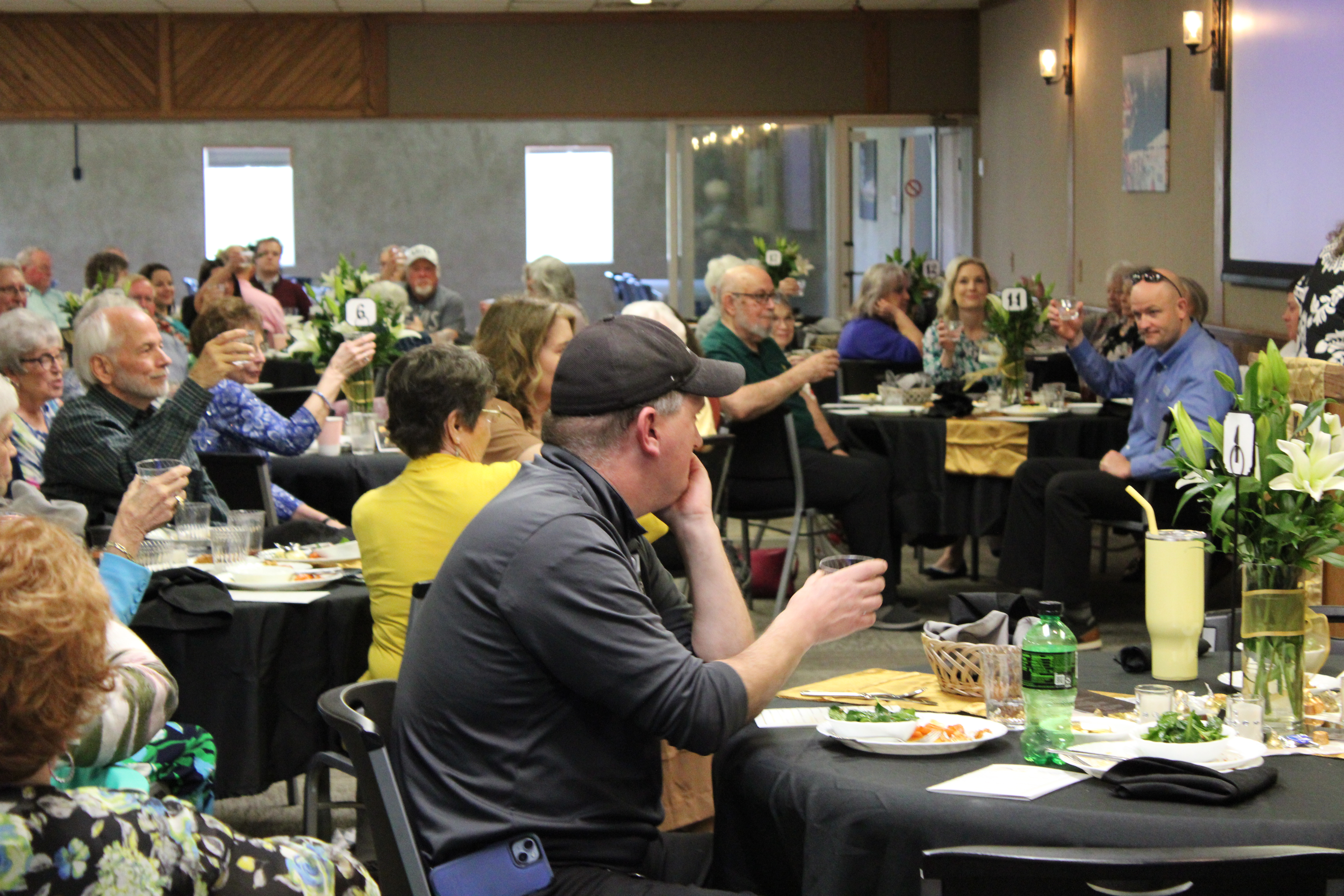 Attendees toasted to 75 years of service.