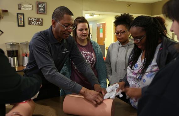 Phelps Health instructor teaching students to control bleeding