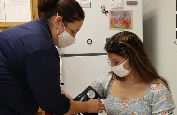 Student receiving sports physical