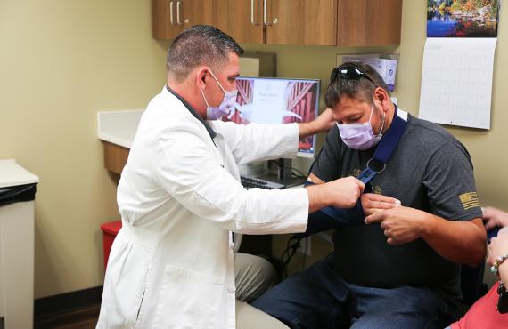 Dr. Turk Satterly Treats Patient Dr. Satterly treats a patient in the Orthopedics Clinic