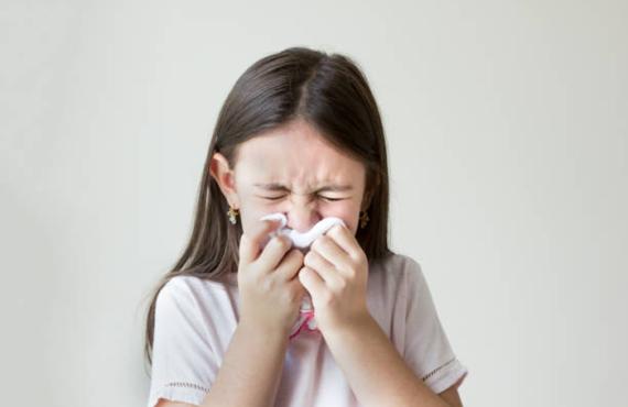 Girl blowing nose Girl blowing nose