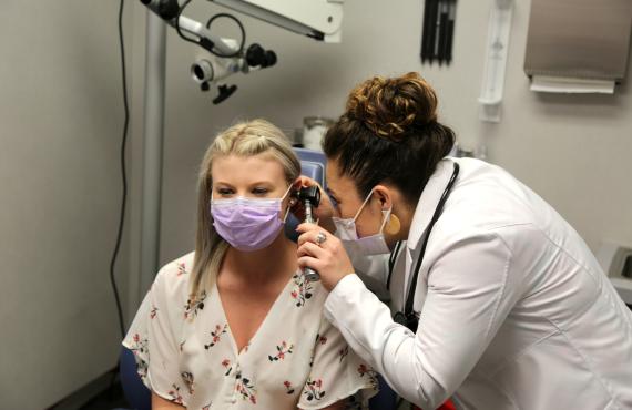 Dr. Hernandez with a female patient