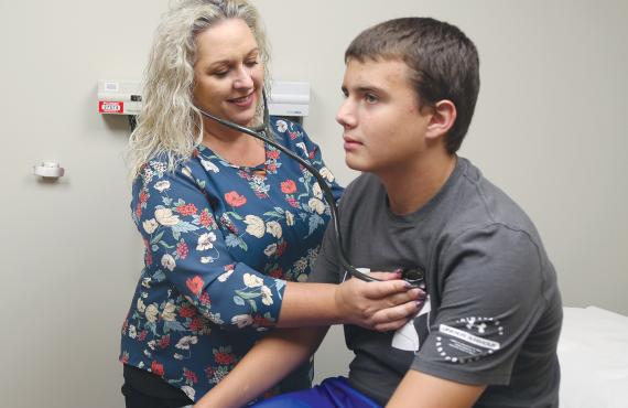 FNP Miriam Stricklan with a patient