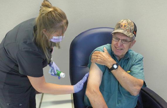 A Phelps Health nurse gives allergy shots to a male patient