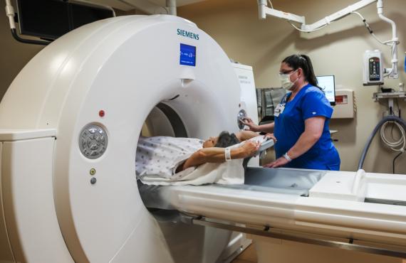 A patient has a lung cancer screening using a low-dose computed tomography (LDCT) scan with a CT technologist at Phelps Health