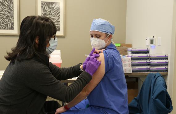 Phelps Health nurse giving a COVID-19 vaccine
