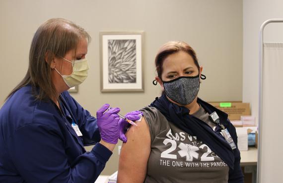 A Phelps Health nurse gives a COVID-19 vaccine to a healthcare worker.