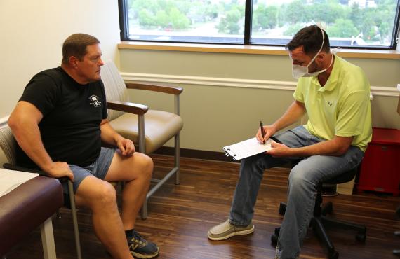 Patient Paul Lambert with Dr. Alan Heincker in a clinic