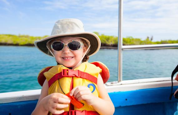 Young girl in lifejacket on boat