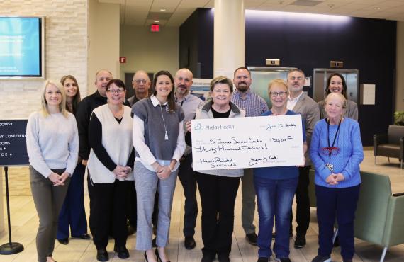 Phelps Health presents a check to the St. James Senior Center